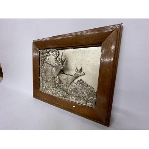 47 - TWO SILVER PLATED FRAMED DEER IN 3D RELIEF, SIGNED TO THE REAR