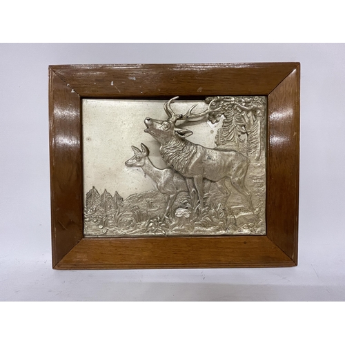 47 - TWO SILVER PLATED FRAMED DEER IN 3D RELIEF, SIGNED TO THE REAR