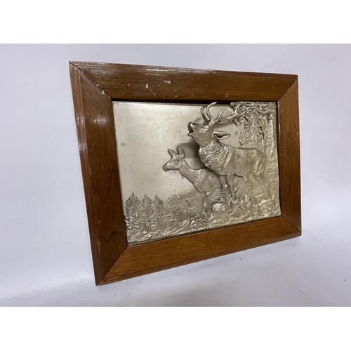 47 - TWO SILVER PLATED FRAMED DEER IN 3D RELIEF, SIGNED TO THE REAR