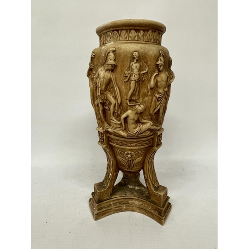 63 - A LARGE STONEWARE VASE WITH RELIEF CLASSICAL DECORATION ON A TRIPOD STYLE BASE, HEIGHT 43CM