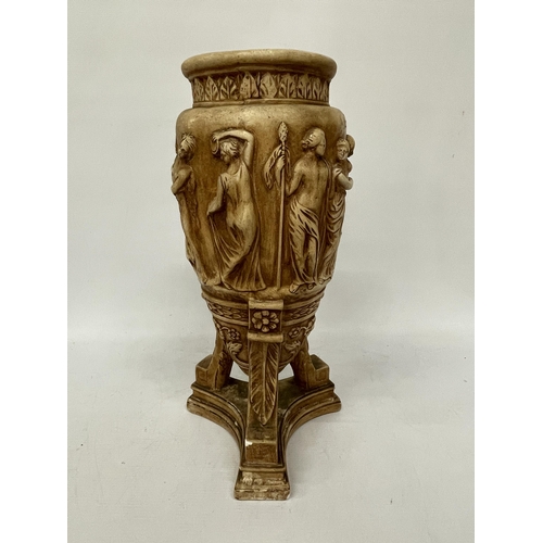 63 - A LARGE STONEWARE VASE WITH RELIEF CLASSICAL DECORATION ON A TRIPOD STYLE BASE, HEIGHT 43CM