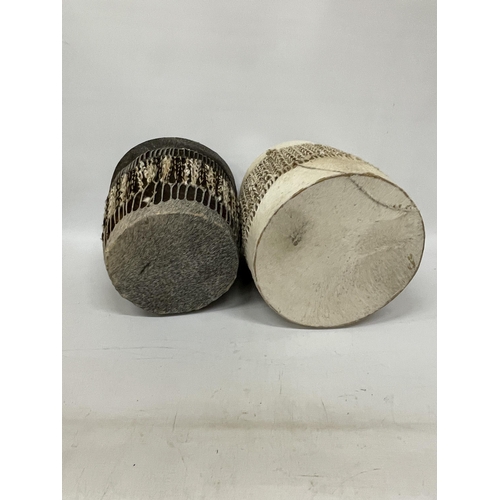 64 - TWO AFRICAN TRIBAL HIDE BONGO DRUMS