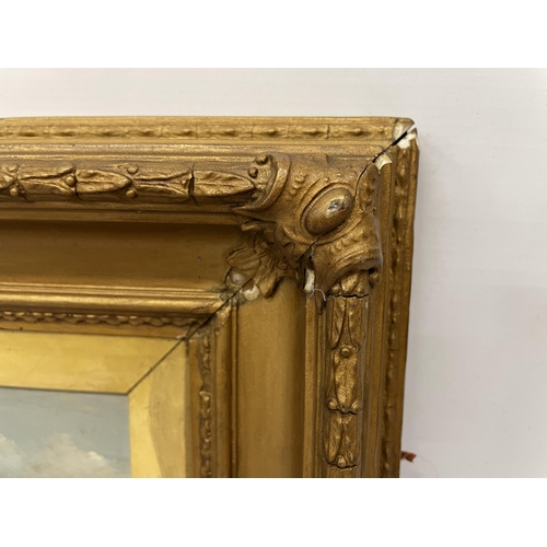 69 - AN OIL ON BOARD OF ST MICHAEL'S MOUNT SIGNED R H EARWICKER 1894 IN AN ORNATE GILT FRAME