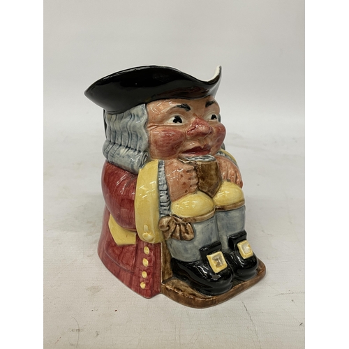 734 - A CLARICE CLIFF TOBY JUG MODELLED AS A SEATED GENT WITH FOAMING MUG PAINTED IN UNDERGLAZE COLOURS