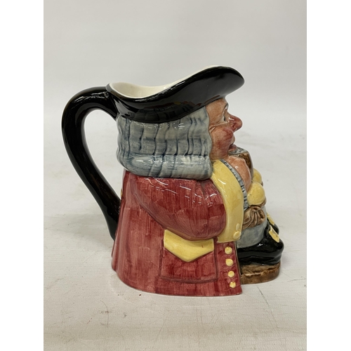 734 - A CLARICE CLIFF TOBY JUG MODELLED AS A SEATED GENT WITH FOAMING MUG PAINTED IN UNDERGLAZE COLOURS