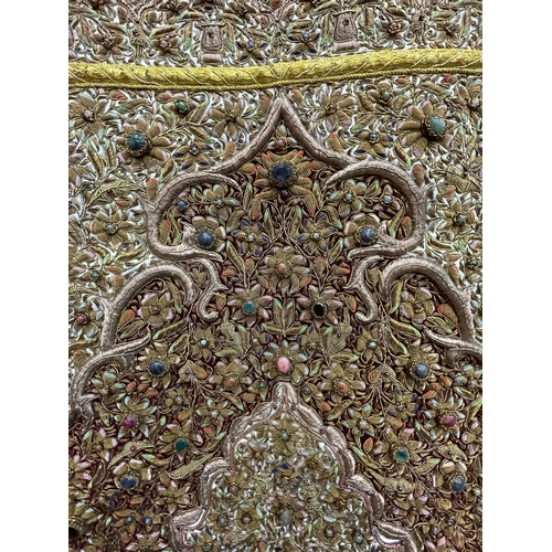 99 - A HEAVILY EMBROIDERED AND BEADED SATIN BACKED WALL HANGING, EMBELLISHED WITH SEMI PRECIOUS STONES 95... 