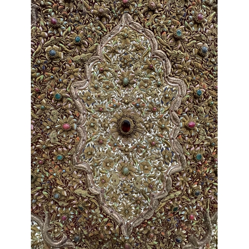 99 - A HEAVILY EMBROIDERED AND BEADED SATIN BACKED WALL HANGING, EMBELLISHED WITH SEMI PRECIOUS STONES 95... 