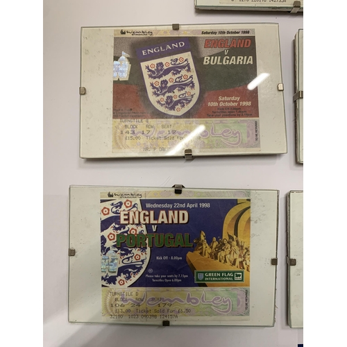 296 - FIVE FRAMED AND GLAZED VINTAGE ENGLAND WEMBLEY FOOTBALL TICKETS