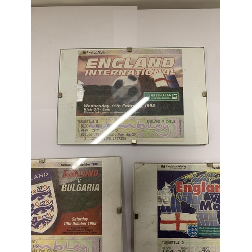 296 - FIVE FRAMED AND GLAZED VINTAGE ENGLAND WEMBLEY FOOTBALL TICKETS