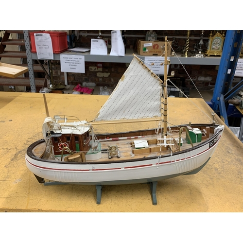 410 - A WOODEN MODEL OF A FISHING BOAT