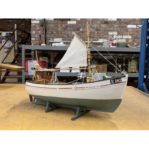 410 - A WOODEN MODEL OF A FISHING BOAT