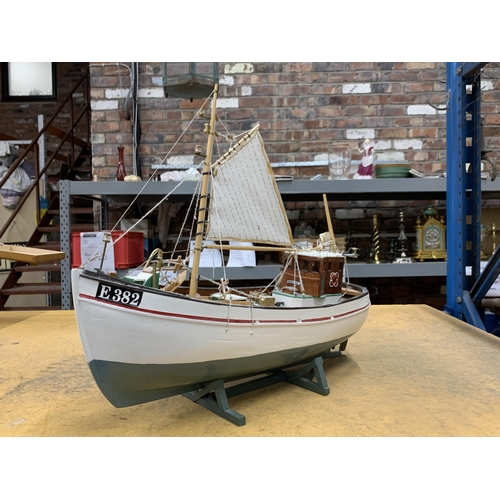 410 - A WOODEN MODEL OF A FISHING BOAT