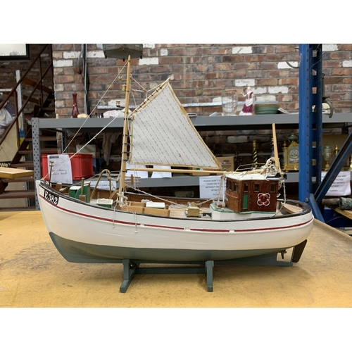 410 - A WOODEN MODEL OF A FISHING BOAT