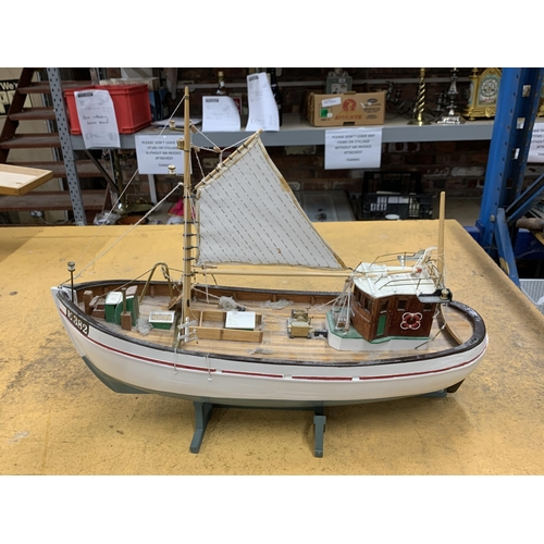 410 - A WOODEN MODEL OF A FISHING BOAT