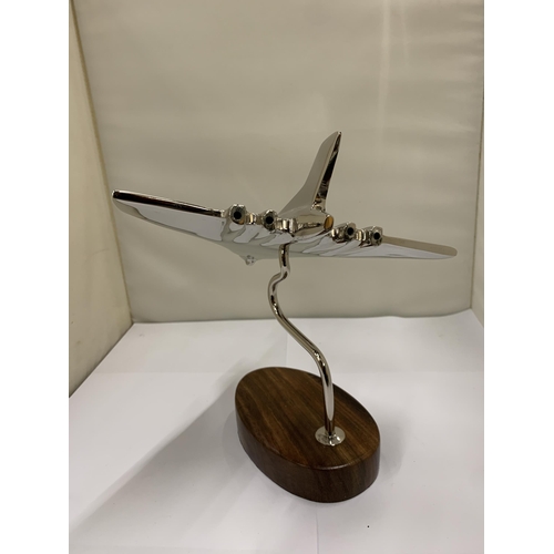 449 - A CHROME VULCAN BOMBER ON A WOODEN BASE, HEIGHT 19CM