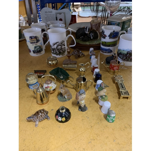 487 - A LARGE MIXED LOT TO INCLUDE A VAN MONEY BOX, THIMBLES, MINIATURE ANIMALS, ETC, MUGS, A CERAMIC FAMI... 