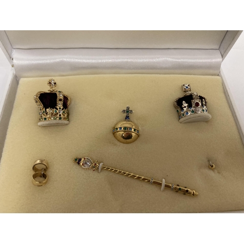 832 - A MINIATURE CROWN JEWELS SET IN PRESENTATION CASE