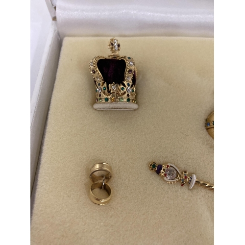 832 - A MINIATURE CROWN JEWELS SET IN PRESENTATION CASE