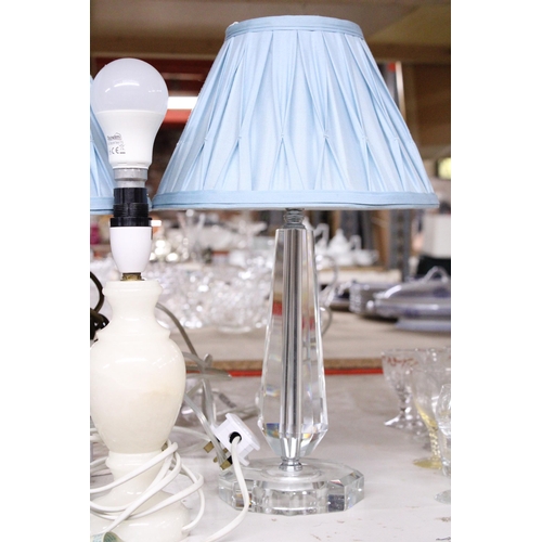 1003 - TWO CRYSTAL TABLE LAMP BASES WITH SHADES TOGETHER WITH AN ONYX LAMP BASE AND A WOODEN LAMP BASE