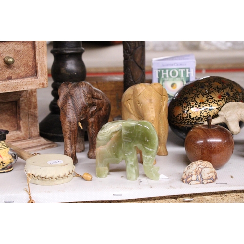 1005 - A MIXED LOT TO INCLUDE WOODEN ELEPHANTS, SMALL CHEST OF DRAWERS, WOODEN CANDLESTICKS, ONYX ELEPHANT ... 