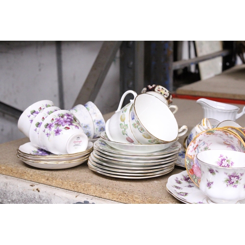 1009 - A LARGE QUANTITY OF CUPS SAUCERS AND SIDE PLATES TO INCLUDE ROYAL ALBERT, COLCLOUGH, ROYAL GRAFTON, ... 