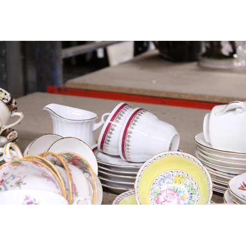 1009 - A LARGE QUANTITY OF CUPS SAUCERS AND SIDE PLATES TO INCLUDE ROYAL ALBERT, COLCLOUGH, ROYAL GRAFTON, ... 