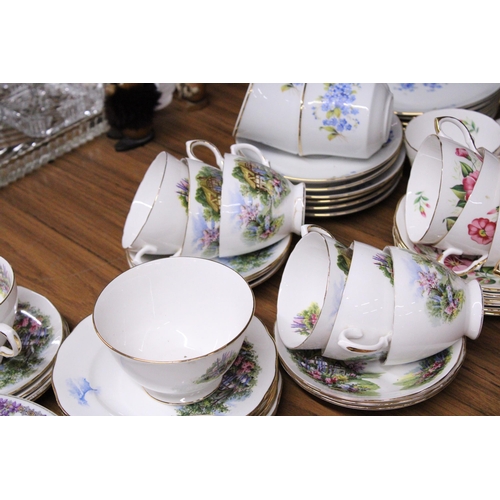 1015 - A QUANTITY OF CUP, SAUCERS AND PLATES TO INCLUDE ROYAL VALE COTTAGE SCENE TEASET, REGENT CHINA FLORA... 