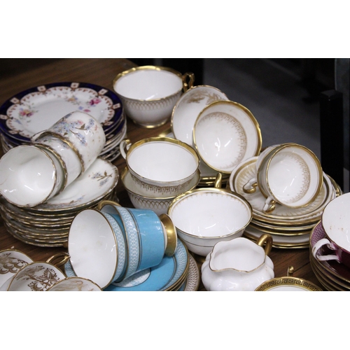 1017 - A LARGE QUANTITY OF TEACUPS, SAUCERS, SIDE PLATES AND MILK JUGS TO INCLUDE MAYFAIR CHINA, SHELLEY, R... 