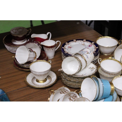 1017 - A LARGE QUANTITY OF TEACUPS, SAUCERS, SIDE PLATES AND MILK JUGS TO INCLUDE MAYFAIR CHINA, SHELLEY, R... 