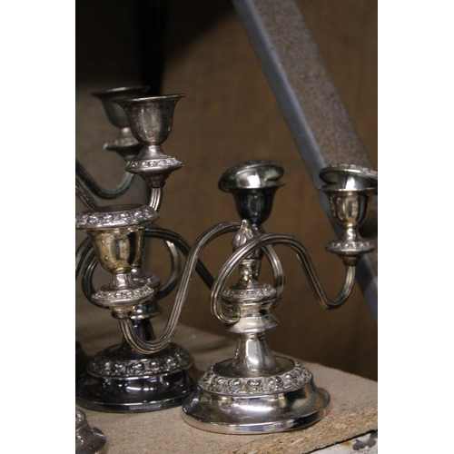 1026 - A COLLECTION OF SILVERPLATE CANDLEABRA'S