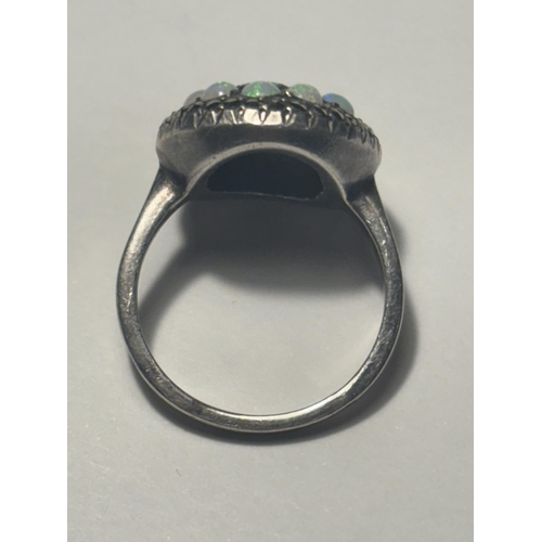 687 - A MARKED SILVER DRESS RING WITH OPALS AND MARCASITE STONES