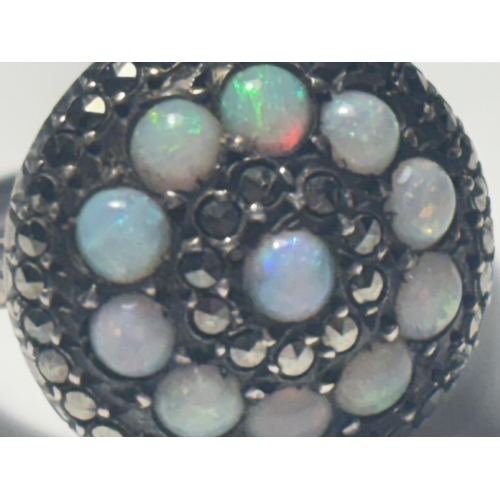 687 - A MARKED SILVER DRESS RING WITH OPALS AND MARCASITE STONES