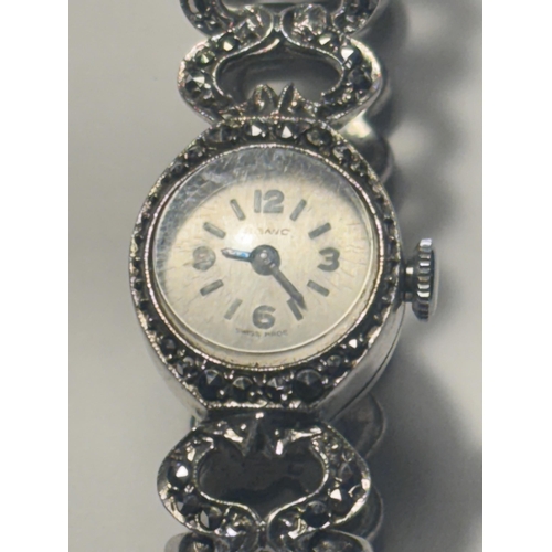 688 - A HALLMARKED LONDON SILVER WRISTWATCH WITH STRAP INSET WITH STONES