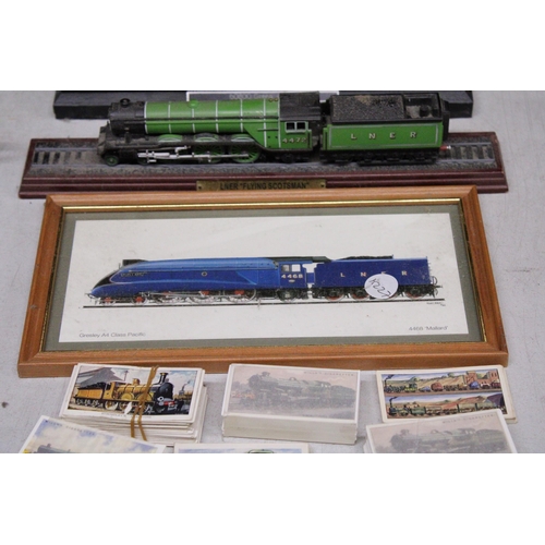 879 - A QUANTITY OF RAILWAY RELATED ITEMS TO INCLUDE THREE MODELS OF TRAINS, TEA CARDS, A PORE-DECIMAL COI... 