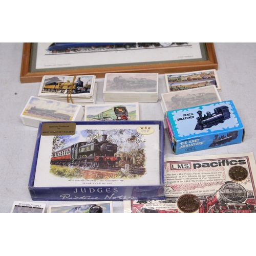 879 - A QUANTITY OF RAILWAY RELATED ITEMS TO INCLUDE THREE MODELS OF TRAINS, TEA CARDS, A PORE-DECIMAL COI... 