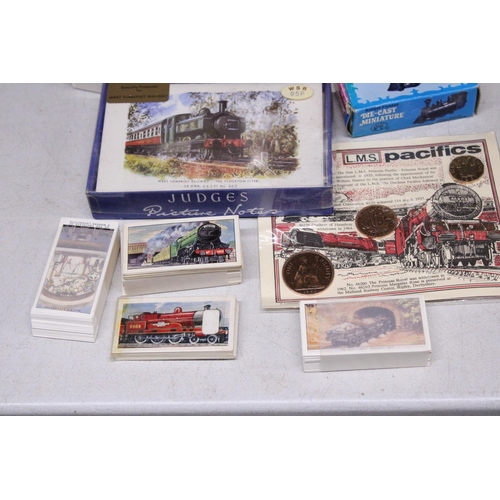 879 - A QUANTITY OF RAILWAY RELATED ITEMS TO INCLUDE THREE MODELS OF TRAINS, TEA CARDS, A PORE-DECIMAL COI... 