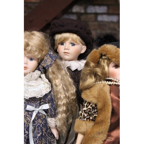 892 - SIX COLLECTABLE DOLLS