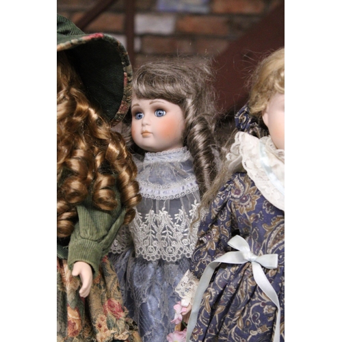 892 - SIX COLLECTABLE DOLLS