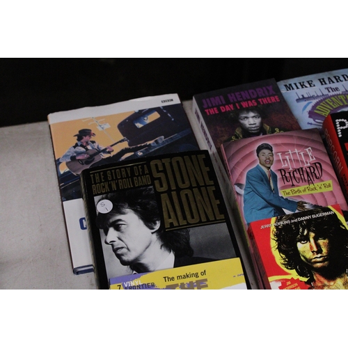 911 - A COLLECTION OF MUSIC BOOKS TO INCLUDE THE STONE ROSES, PHIL SPECTOR, ETC