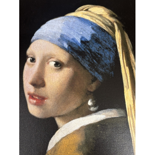 1043 - A FRAMED OIL ON CANVAS OF A GIRL WITH A PEARL EARRING AFTER JOHANNES VERMEER