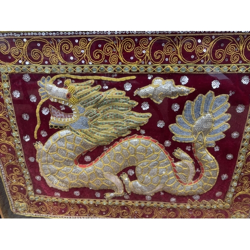 370 - A VINTAGE FRAMED AND GLAZED BEADED SEQUINED CHINESE DRAGON EMBROIDERY TAPESTRY ART - 64 X 49 CM