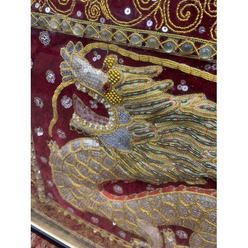 370 - A VINTAGE FRAMED AND GLAZED BEADED SEQUINED CHINESE DRAGON EMBROIDERY TAPESTRY ART - 64 X 49 CM