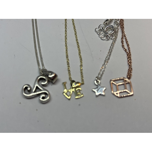 580 - FOUR MARKED SILVER NECKLACES WITH PENDANTS TO INCLUDE A YELLOW GOLD AND A ROSE GOLD PLATED