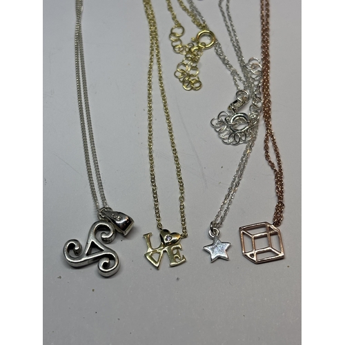 580 - FOUR MARKED SILVER NECKLACES WITH PENDANTS TO INCLUDE A YELLOW GOLD AND A ROSE GOLD PLATED