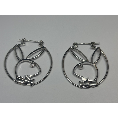 613 - A PAIR OF SILVER PLAYBOY EARRINGS