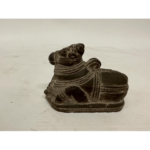 123 - A BLACK STONE NANDI FIGURE TOGETHER WITH A POSSIBLE INDIA GUJARAT FALUS COIN