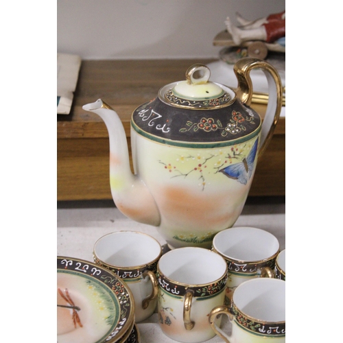 369 - A JAPANESE HAND PAINTED PORCELAIN 15 PIECE COFFEE SET WITH BUTTERFLY AND DRAGONFLY MOTIF