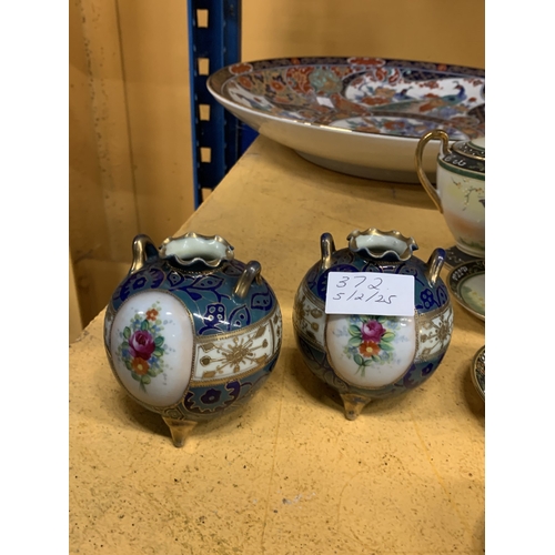 372 - A PAIR OF NORITAKE JAPANESE HAND PAINTED FLORAL DESIGN CAULDRON TRIPOD VASES WITH GOLD MORIAGE