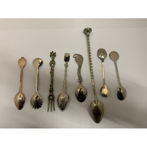 433 - A COLLECTION OF SEVEN DECORATIVE SPOONS AND A PICKLE FORK