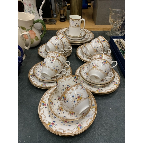 435 - A PART TEA SET 'MADE IN ENGLAND' WITH DECORATIVE GOLD RIM AND FLOWER DECORATION TO INCLUDE TEACUPS, ... 